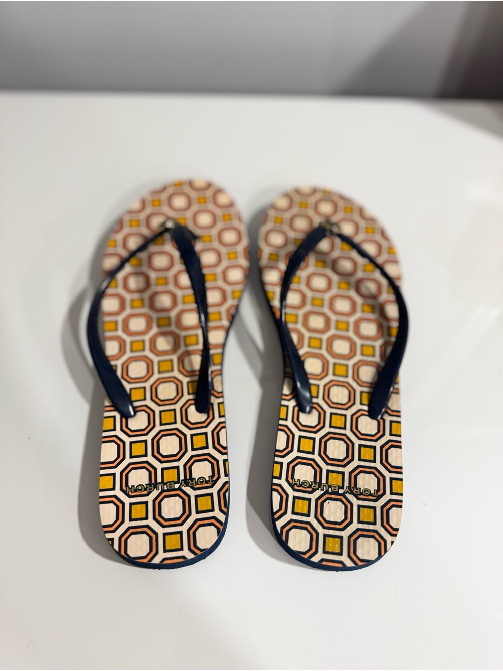 Tory Burch Geometric Pattern Flip Flops with Navy Straps